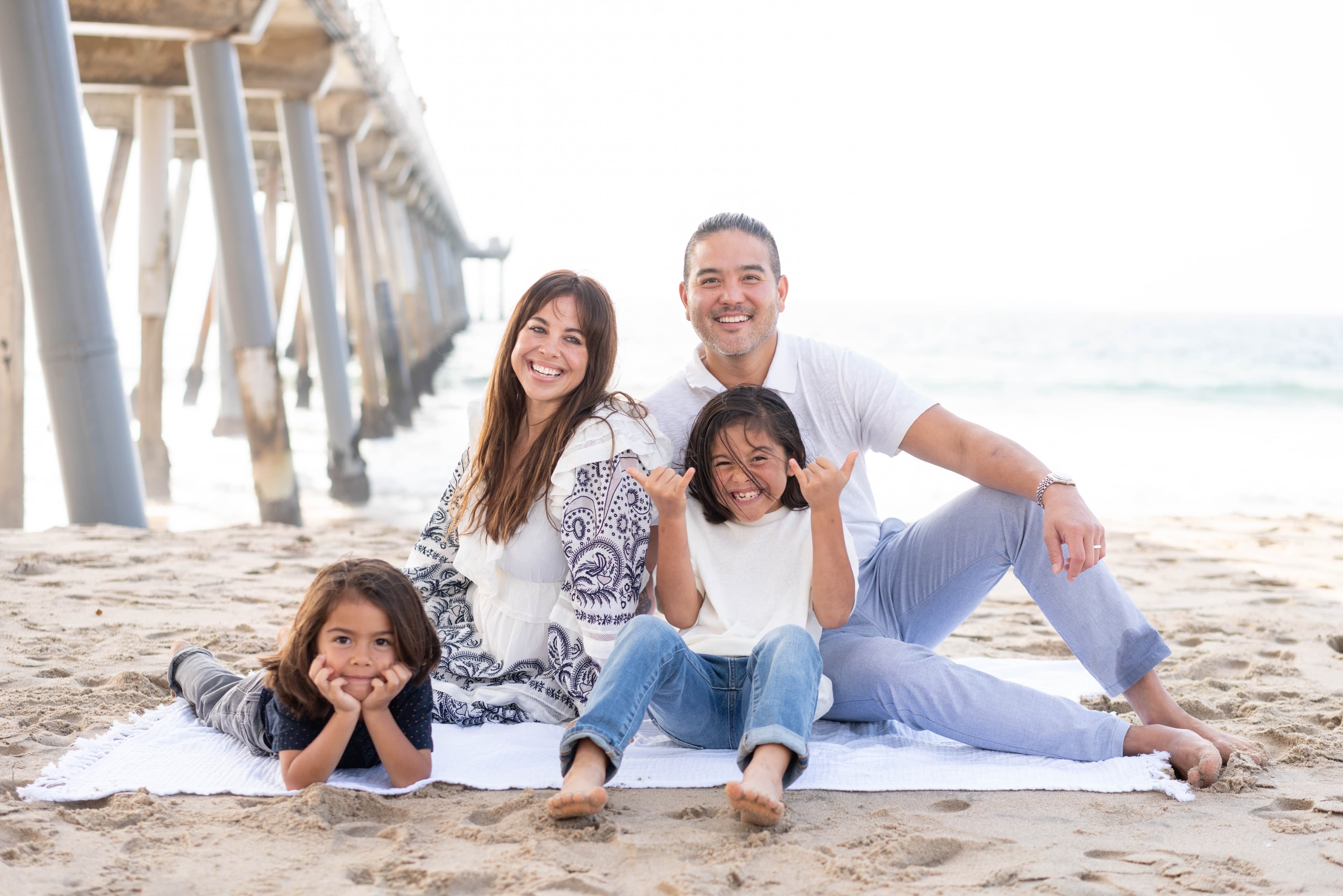 Chris Wong, founder of Local AI, with his family at the beach